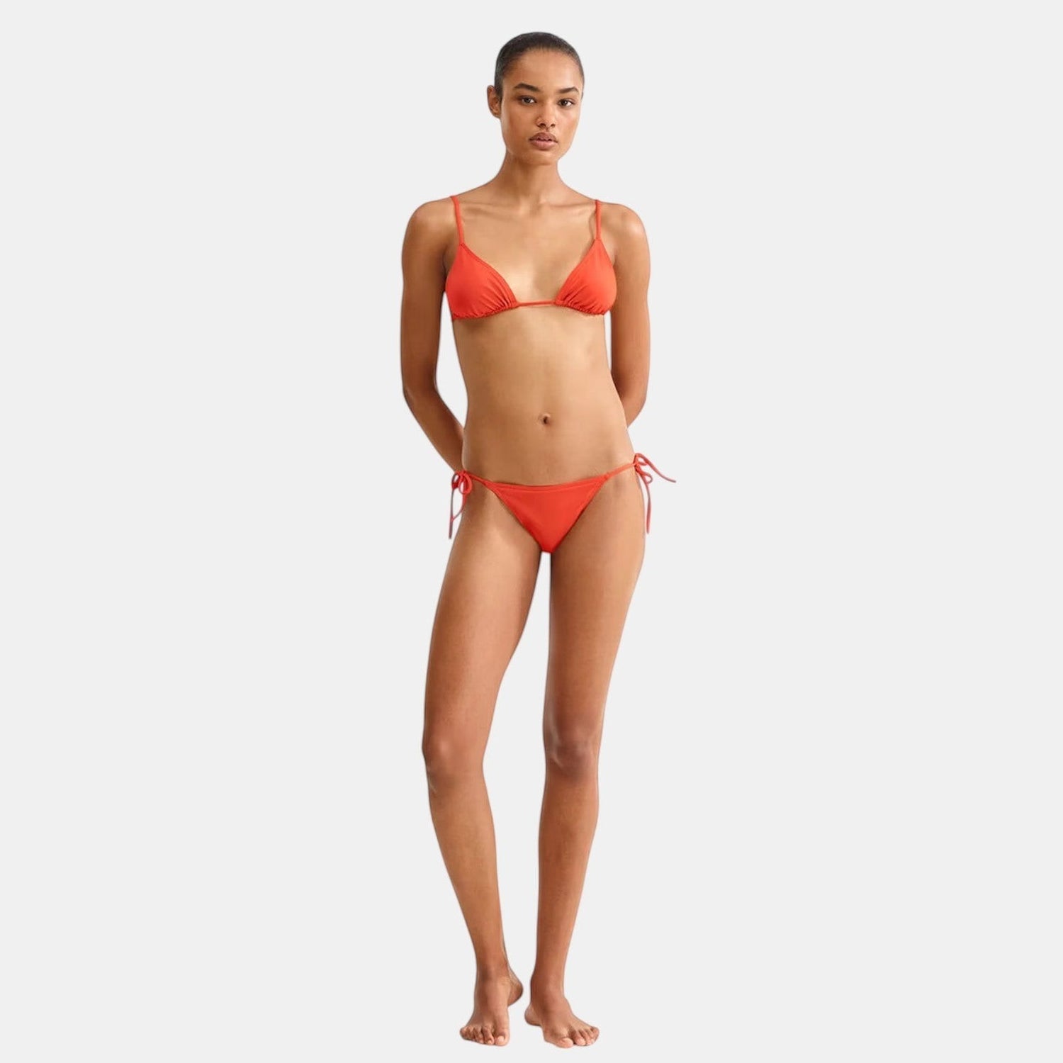 Shop Rescue Spa Malou Rooibos thin bikini briefs in orange with side ties.