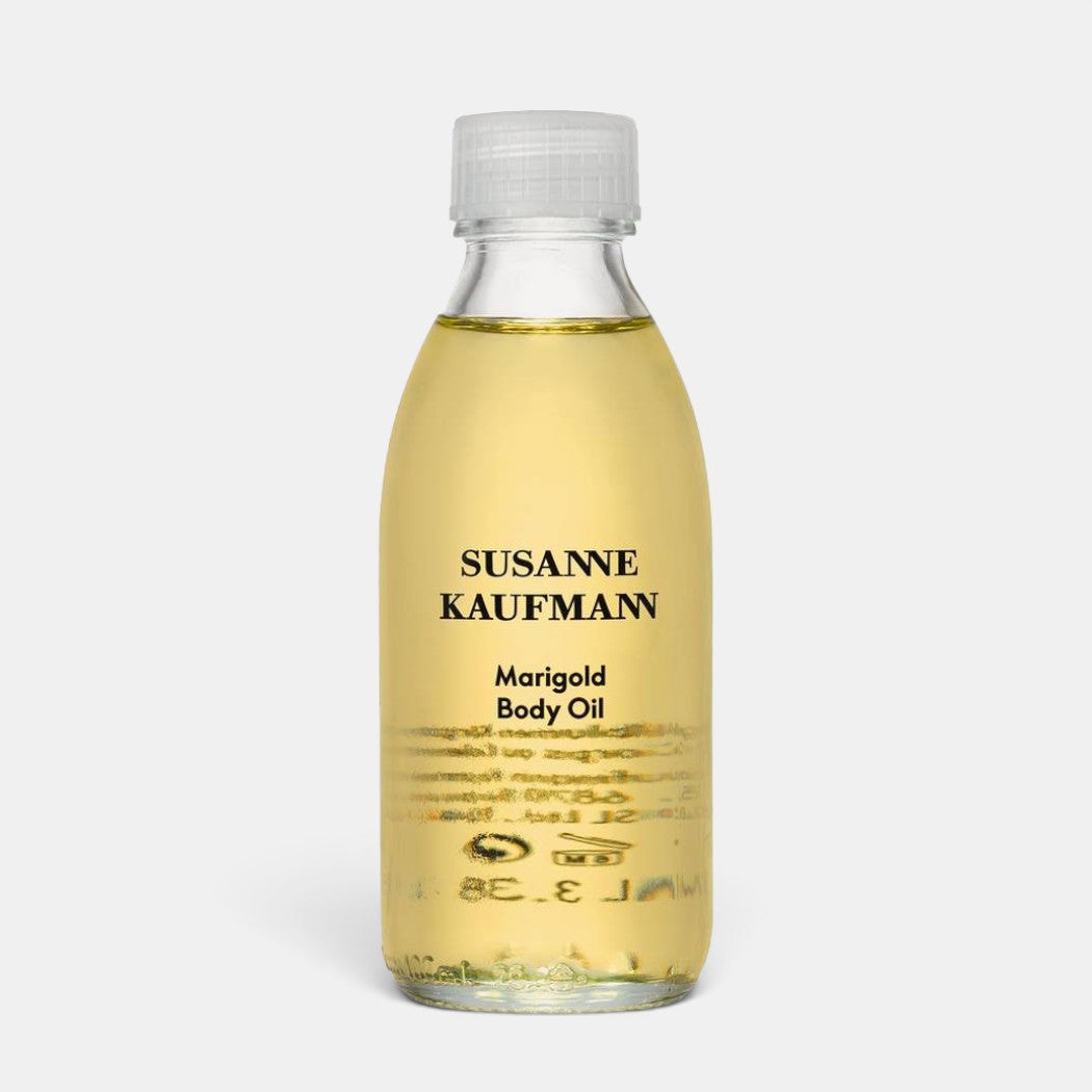 Shop Rescue Spa Susanne Kaufmann Marigold Body Oil in a clear 100ml glass bottle with a white cap