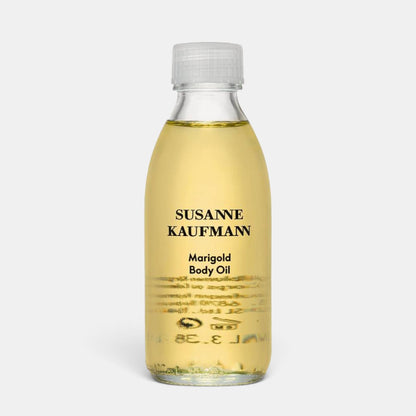 Shop Rescue Spa Susanne Kaufmann Marigold Body Oil in a clear 100ml glass bottle with a white cap