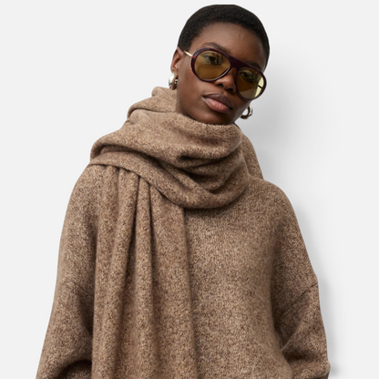 Shop Rescue Spa marled brown cashmere and silk knit scarf worn by a model with tinted sunglasses
