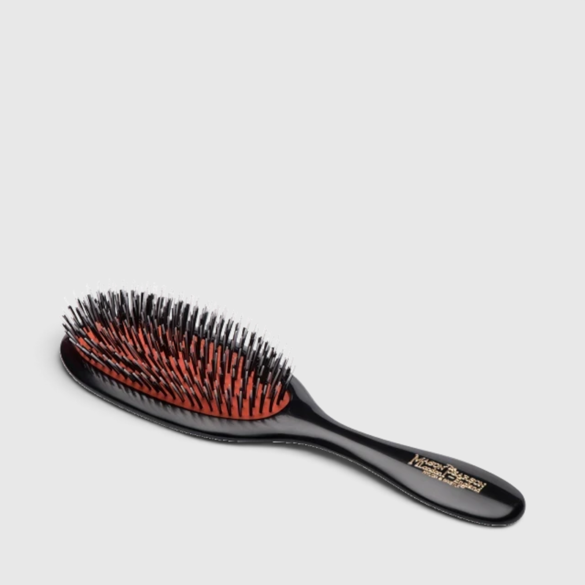 Shop Rescue Spa Mason Pearson Handy BN3 hairbrush with boar bristle and nylon tufts on a dark ruby handle.