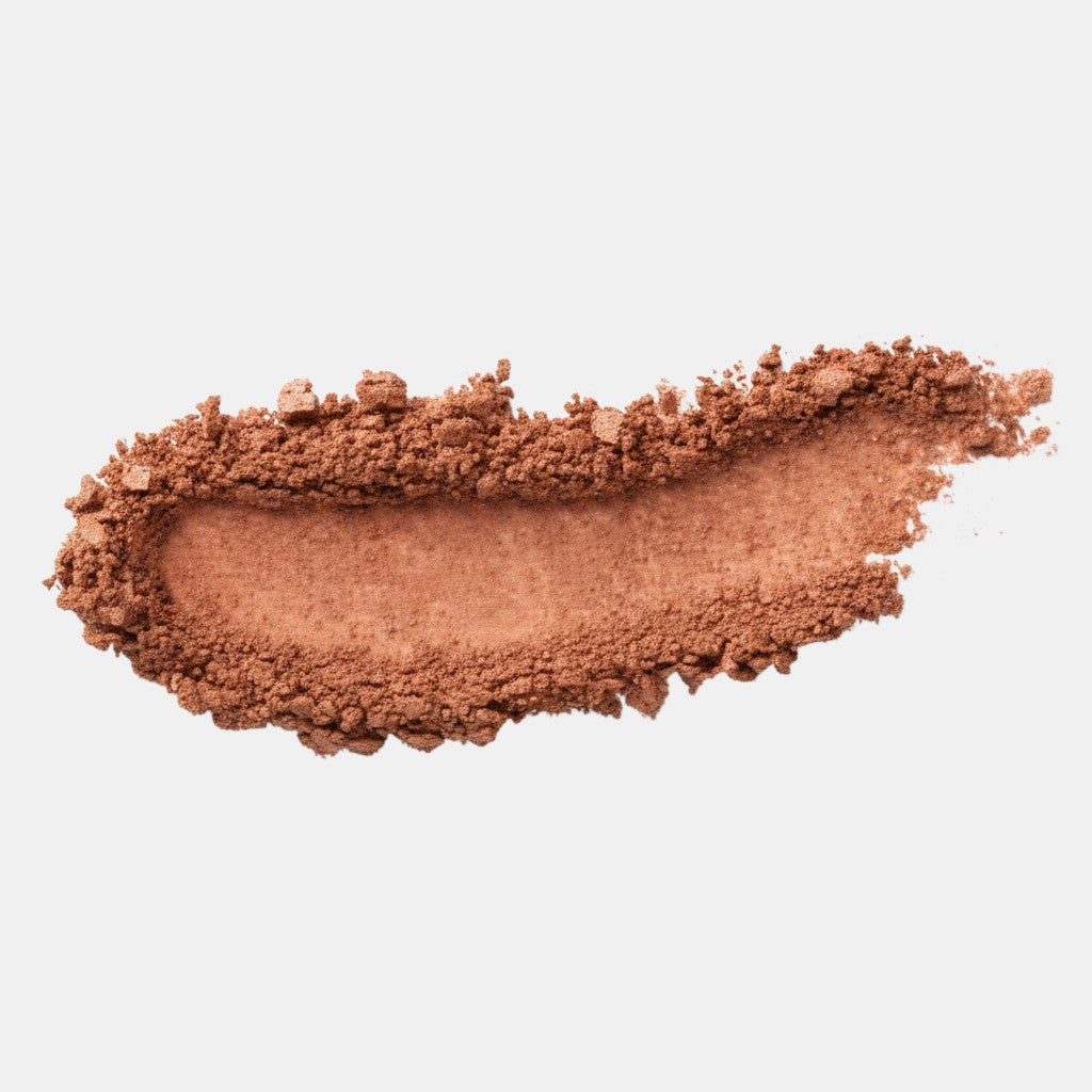 Shop Rescue Spa Beauty Butter Powder Bronzer swatch showing a smooth, matte, warm-toned brown pressed powder texture.