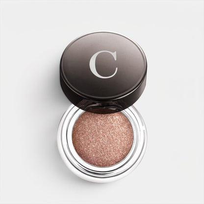 Shop Rescue Spa Mermaid Eye Color metallic bronze cream eyeshadow in a glass pot with a black lid