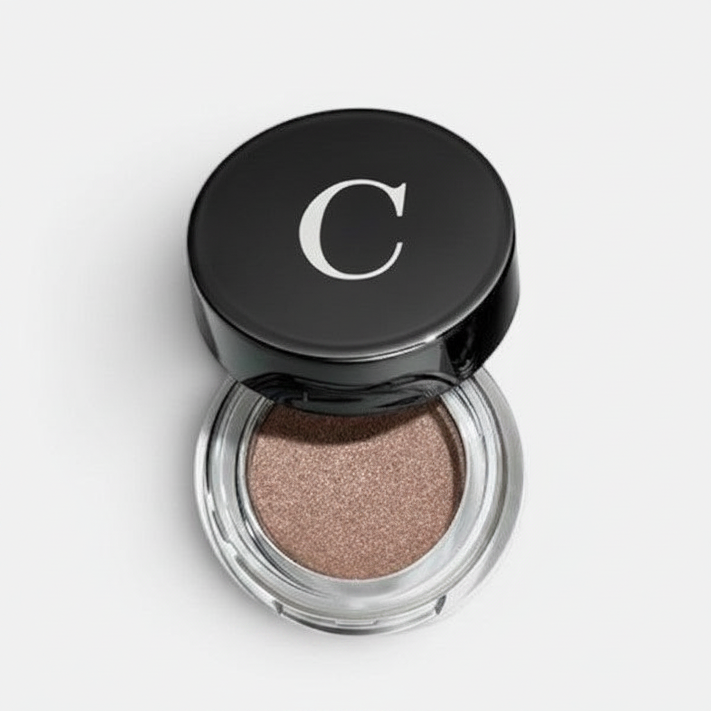 Shop Rescue Spa Mermaid Eye Matte eyeshadow in a shimmering taupe shade with a black lid featuring a white C logo.
