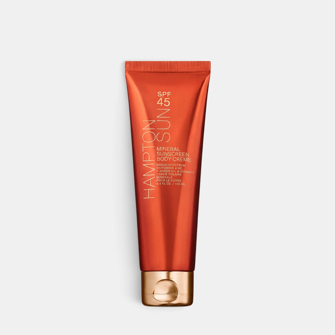 Shop Rescue Spa SPF 45 mineral body sunscreen in a sleek orange tube with a gold cap for broad-spectrum protection.