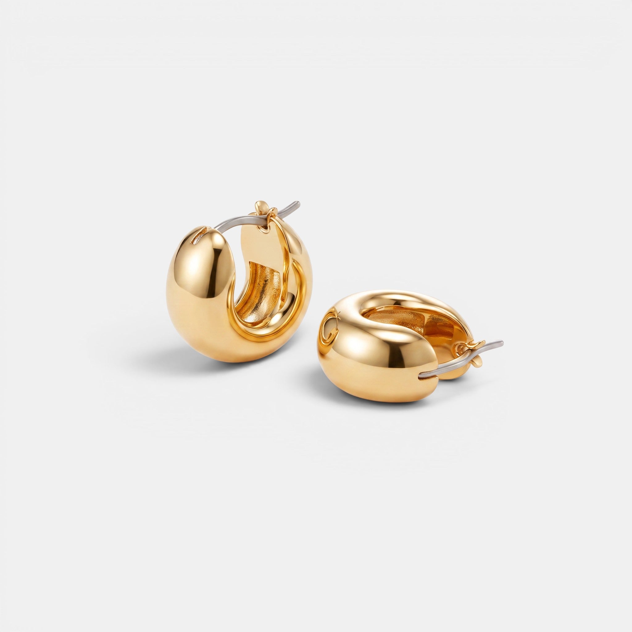 Shop Rescue Spa Mini Tome hoop earrings in high-polish gold with a convenient hinged closure design.