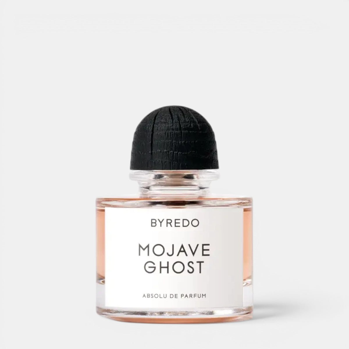Shop Rescue Spa Byredo Mojave Ghost Absolu de Parfum bottle with a textured black wooden cap on a white background.