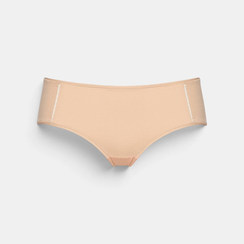 Shop Rescue Spa MONICA low rise boy shorts in beige recycled polyamide jersey with decorative side seam stitching