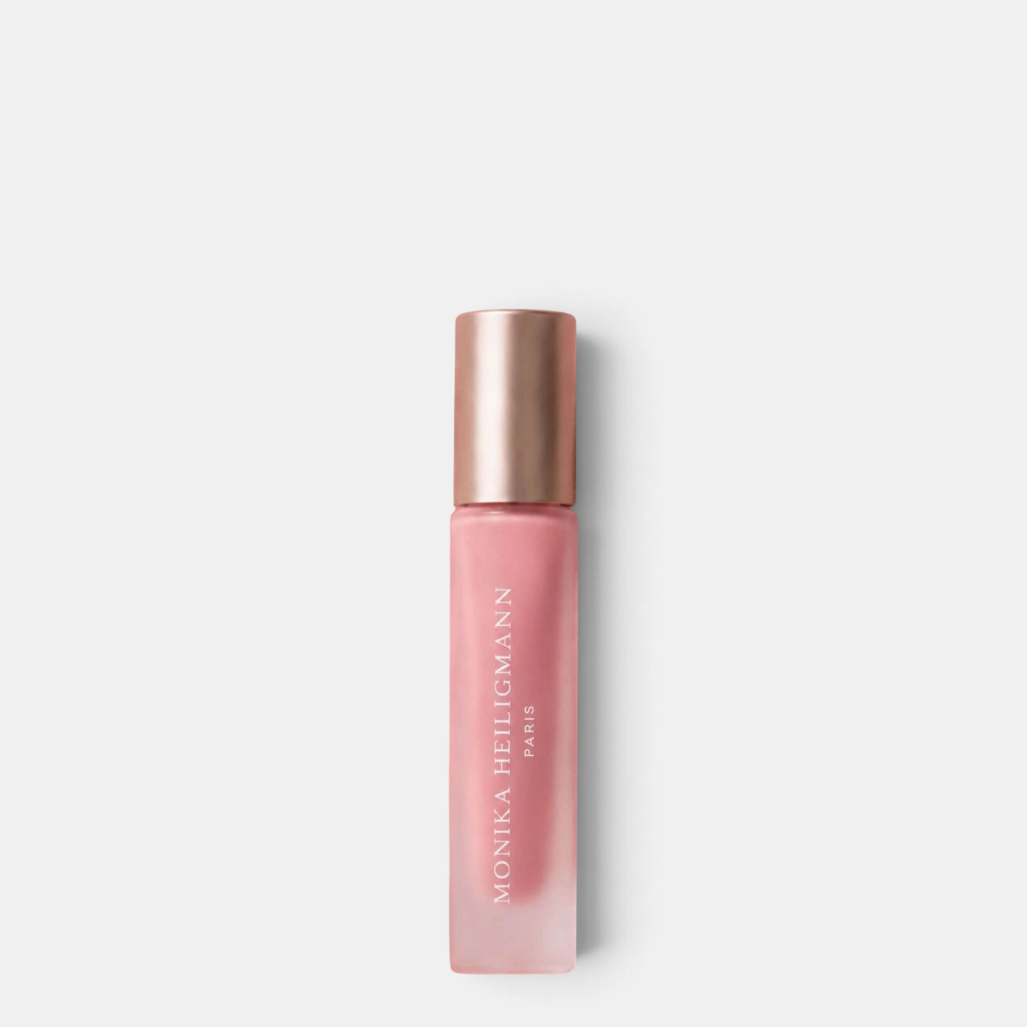 Shop Rescue Spa Monika Heiligmann Paris Elixir de Volume lip volumizing serum in a frosted glass bottle with rose gold cap