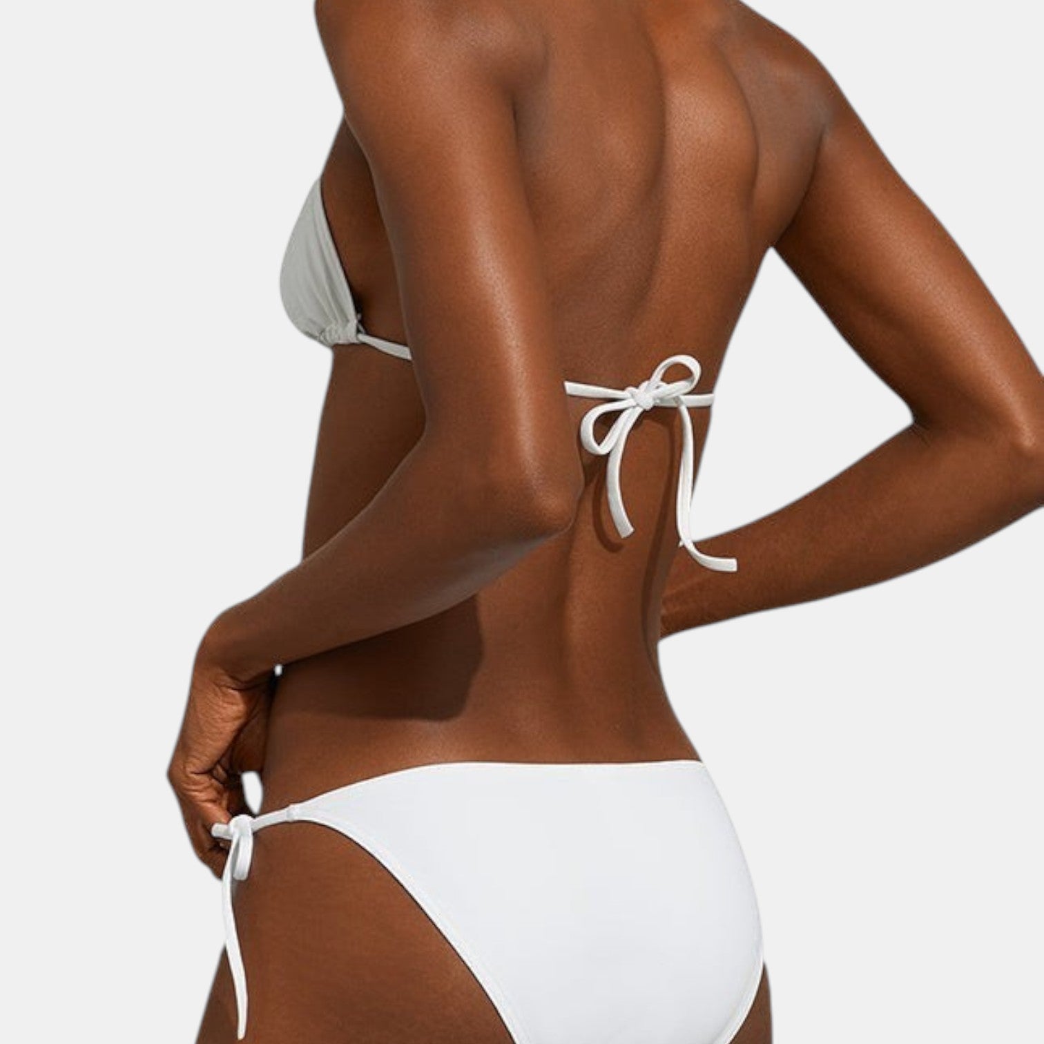 Shop Rescue Spa MOUNA white minimal coverage triangle bikini top with adjustable spaghetti straps on a model