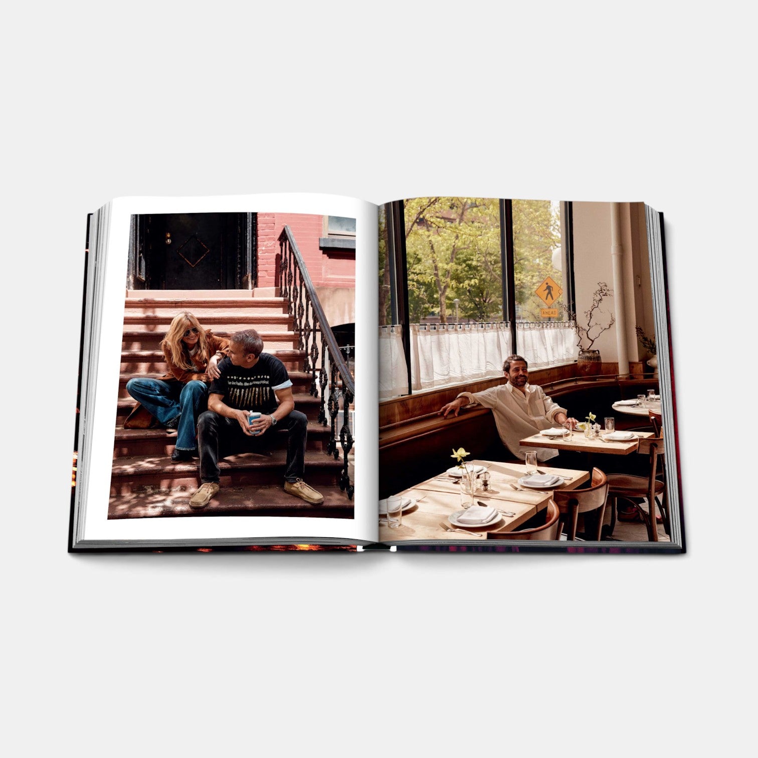 Shop Rescue Spa New York Chic book open to pages showing a couple on brownstone steps and a man in a restaurant