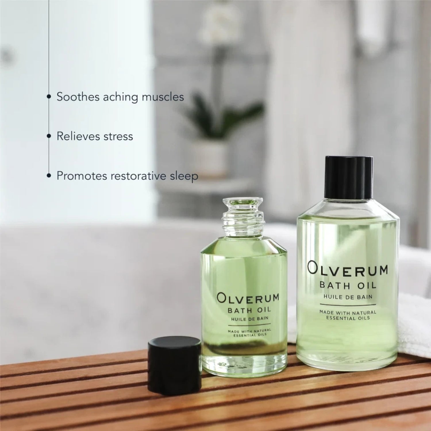 Shop Rescue Spa Olverum bath oil bottles on a wooden bath tray for stress relief and muscle relaxation
