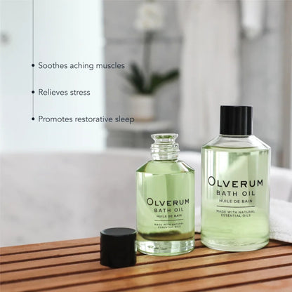 Shop Rescue Spa Olverum bath oil bottles on a wooden bath tray for stress relief and muscle relaxation