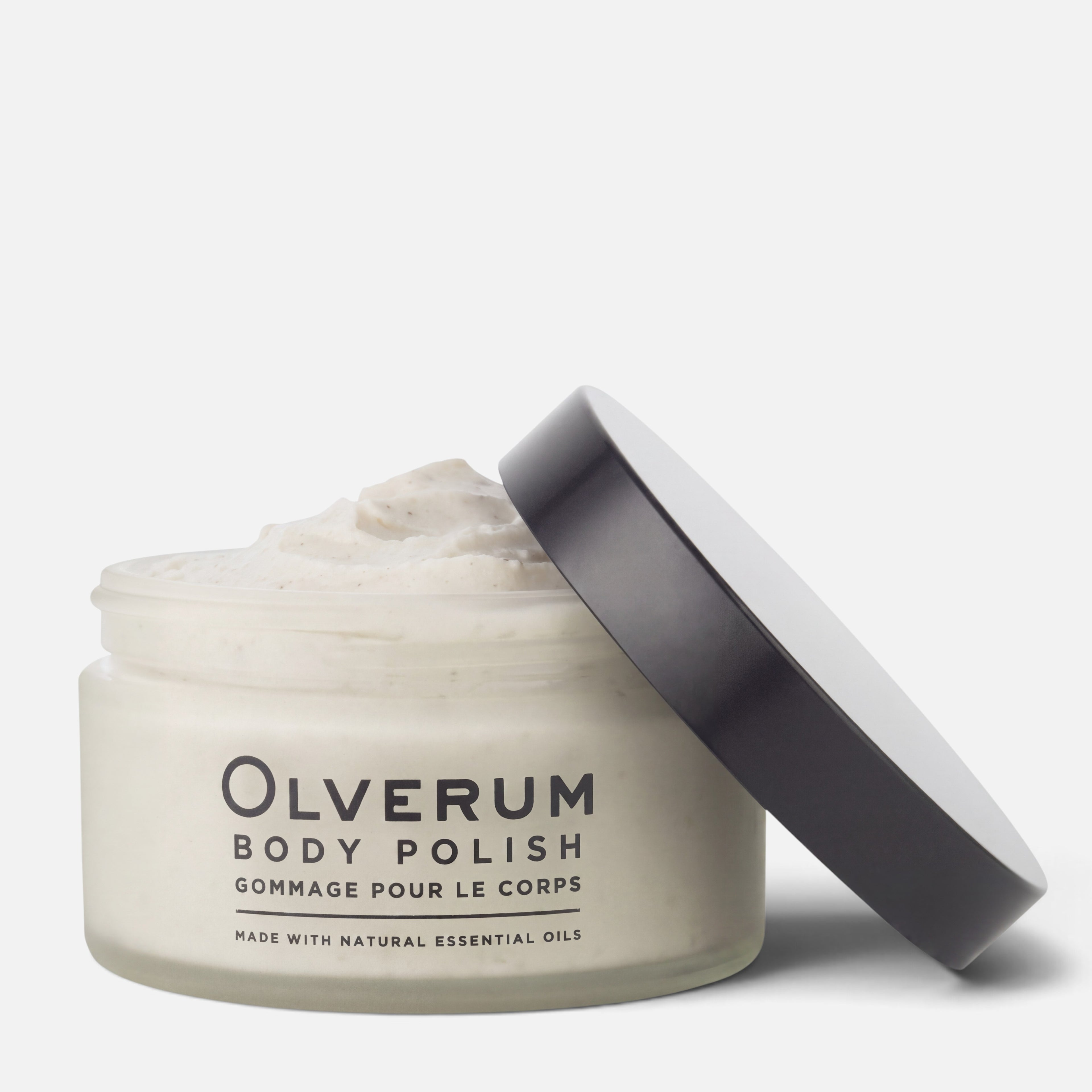 Shop Rescue Spa Olverum Body Polish in a glass jar with a black lid, featuring a creamy, exfoliating texture.