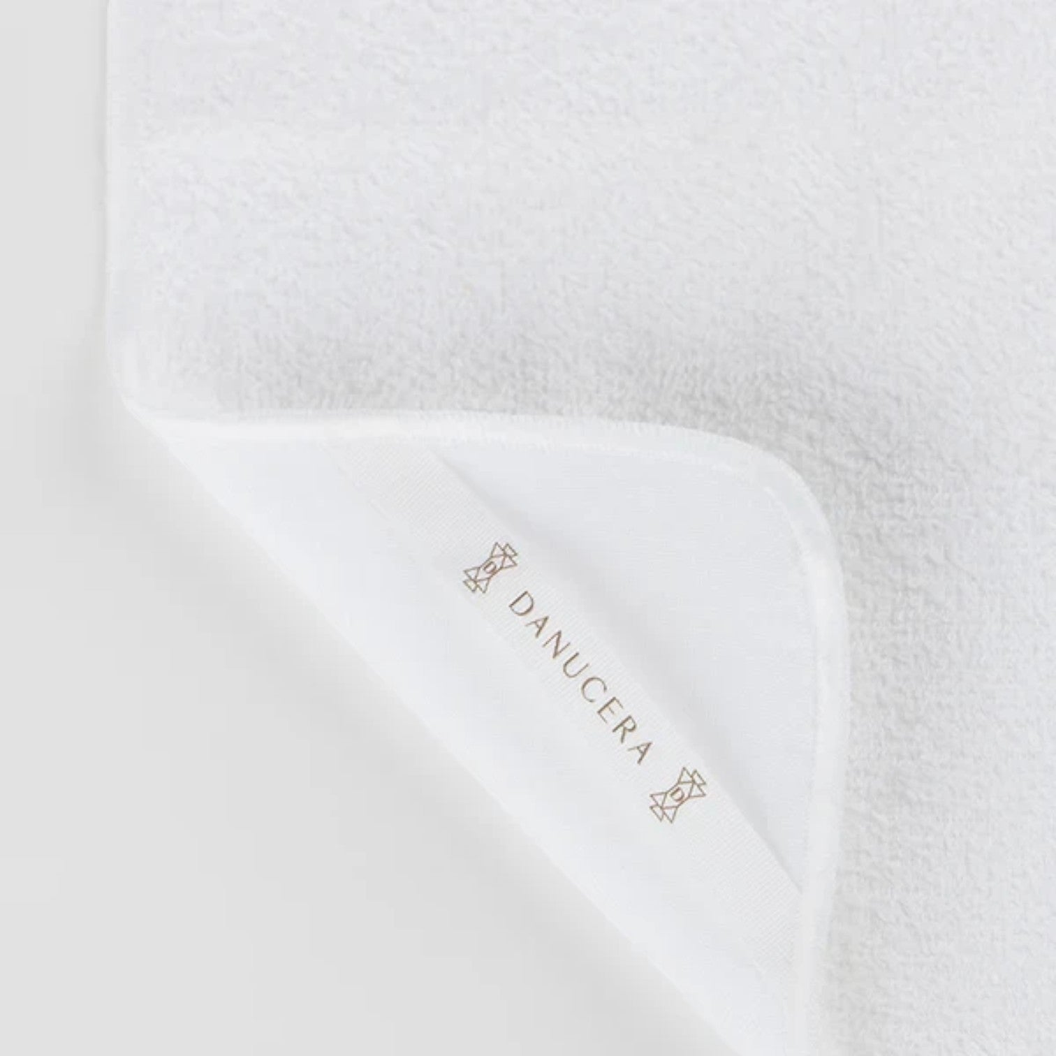 Shop Rescue Spa white organic cotton dual-sided washcloth with terry and muslin textures for double cleansing.
