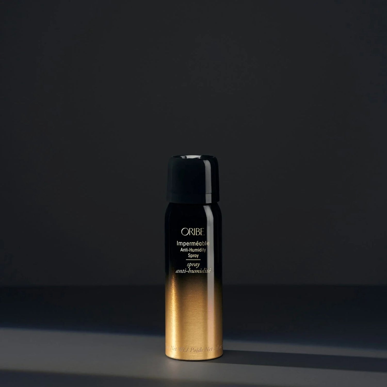 Shop Rescue Spa Oribe Impermeable Anti-Humidity hair spray in a black and gold gradient bottle.