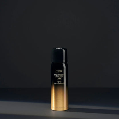 Shop Rescue Spa Oribe Impermeable Anti-Humidity hair spray in a black and gold gradient bottle.
