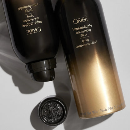 Shop Rescue Spa Oribe Impermeable Anti-Humidity Spray bottles in black and gold packaging on a white surface.