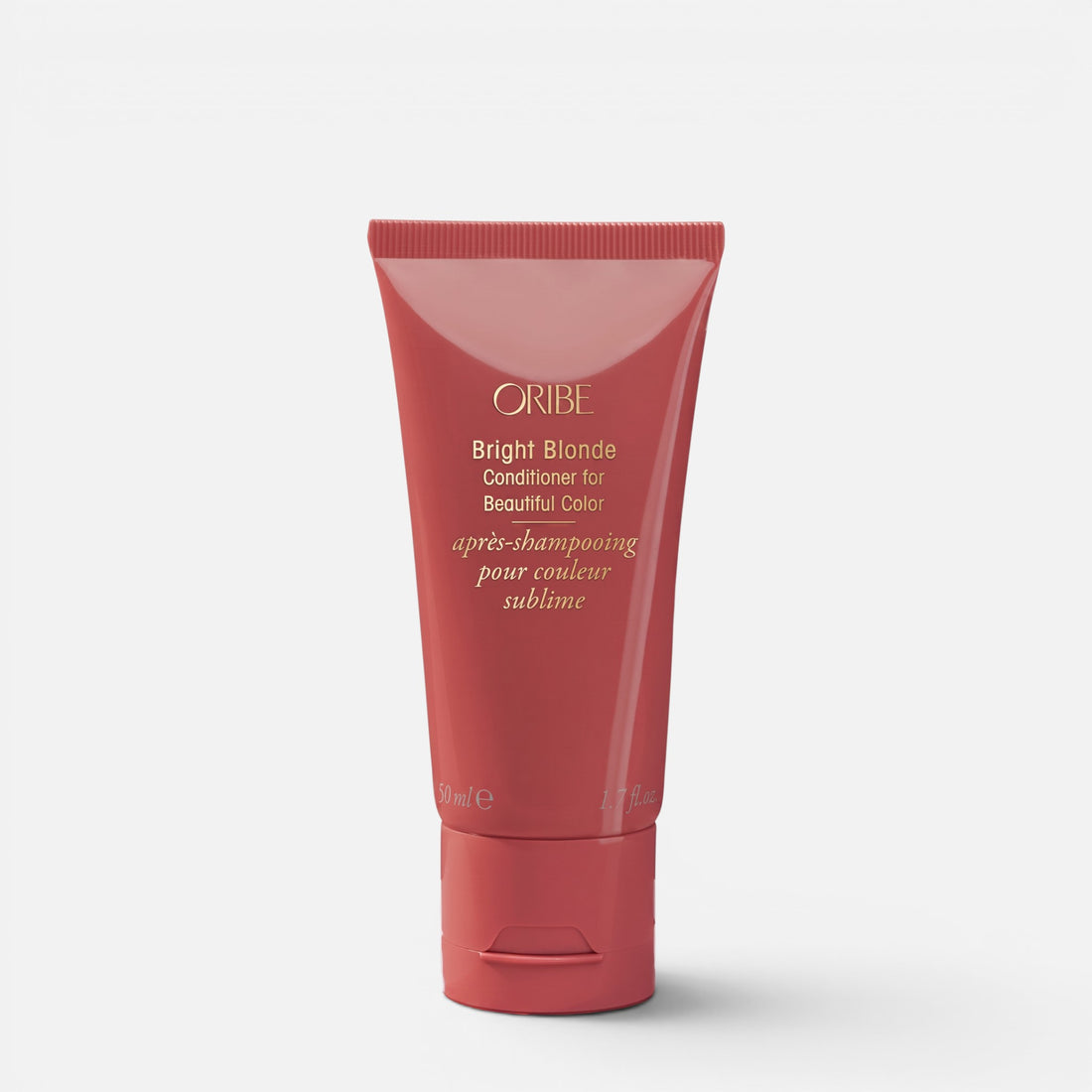 Shop Rescue Spa Oribe Bright Blonde Conditioner in a rose-colored squeeze tube for neutralizing brassy hair tones.