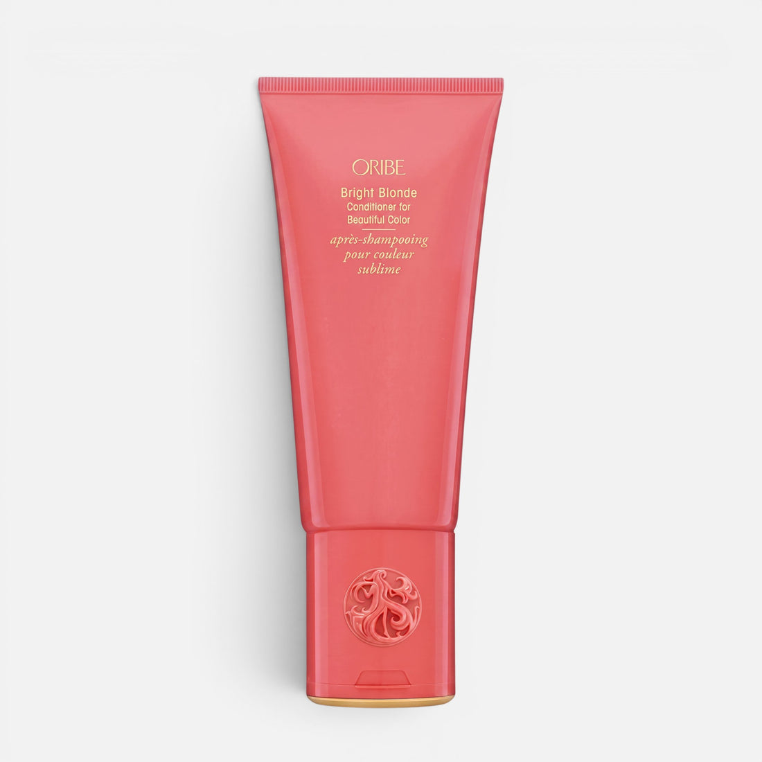 Shop Rescue Spa Oribe Bright Blonde Conditioner in a coral-colored squeeze tube for toning blonde and silver hair.