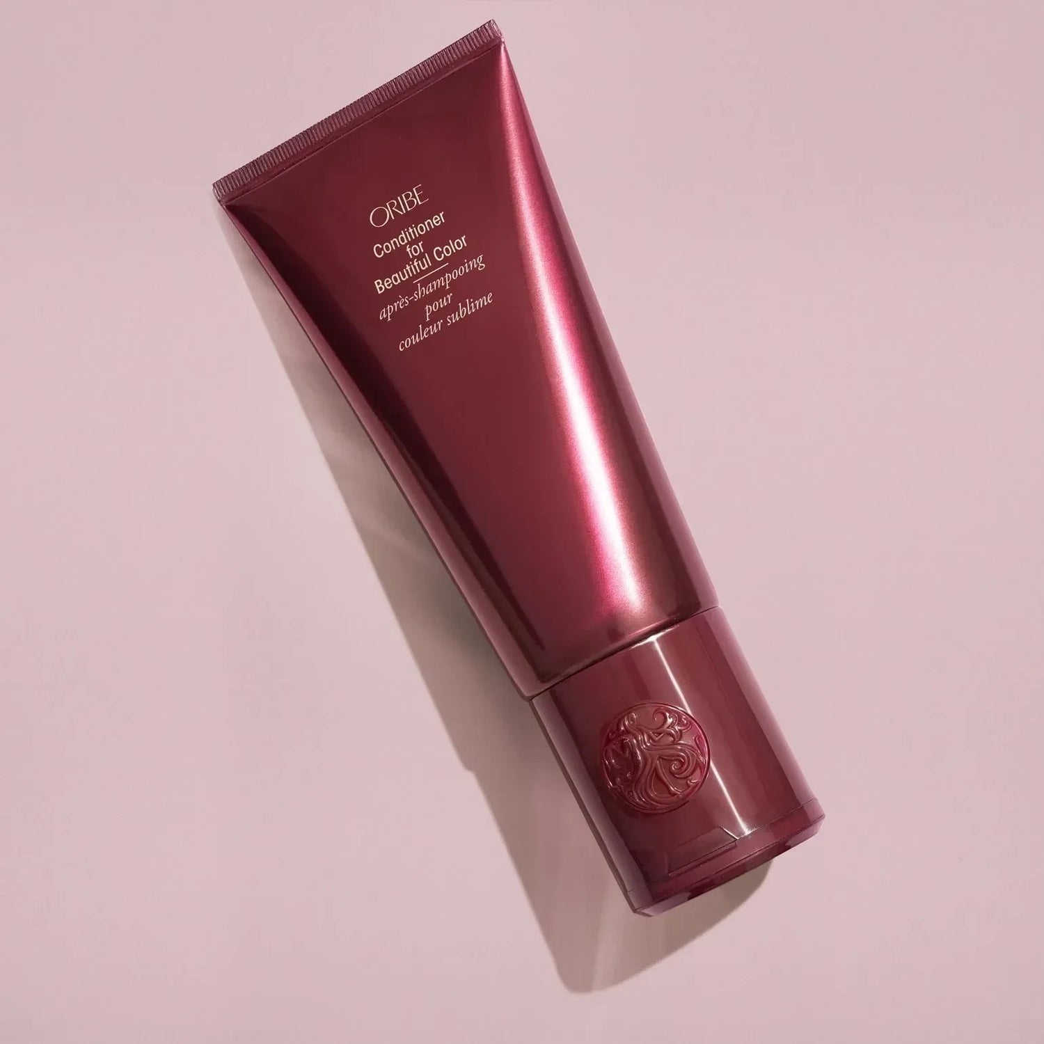 Shop Rescue Spa Oribe Conditioner for Beautiful Color in a deep burgundy tube for color-treated hair.