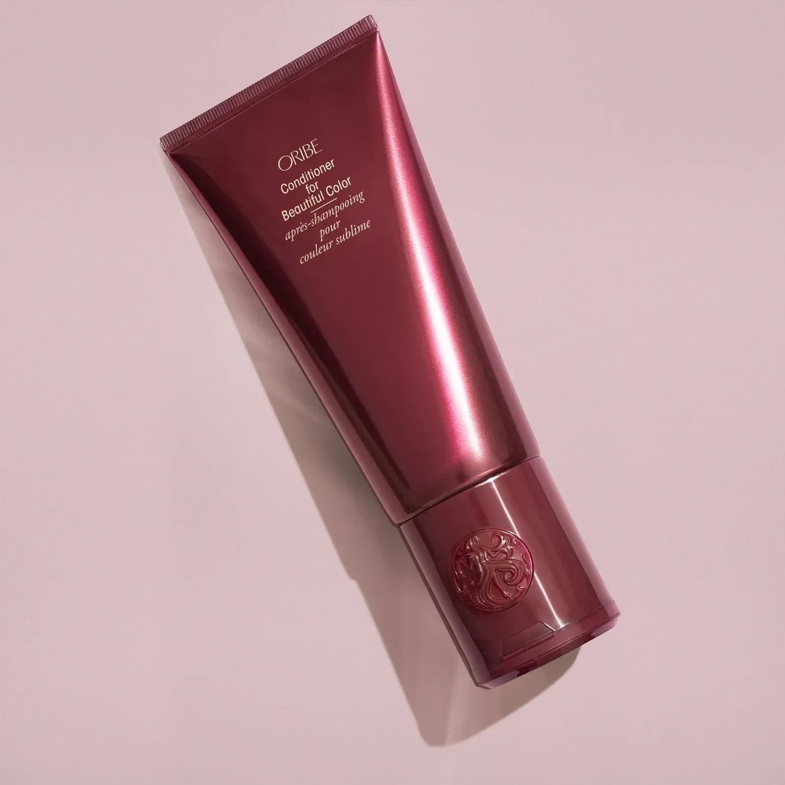 Shop Rescue Spa Oribe Conditioner for Beautiful Color in a deep burgundy tube for color-treated hair.