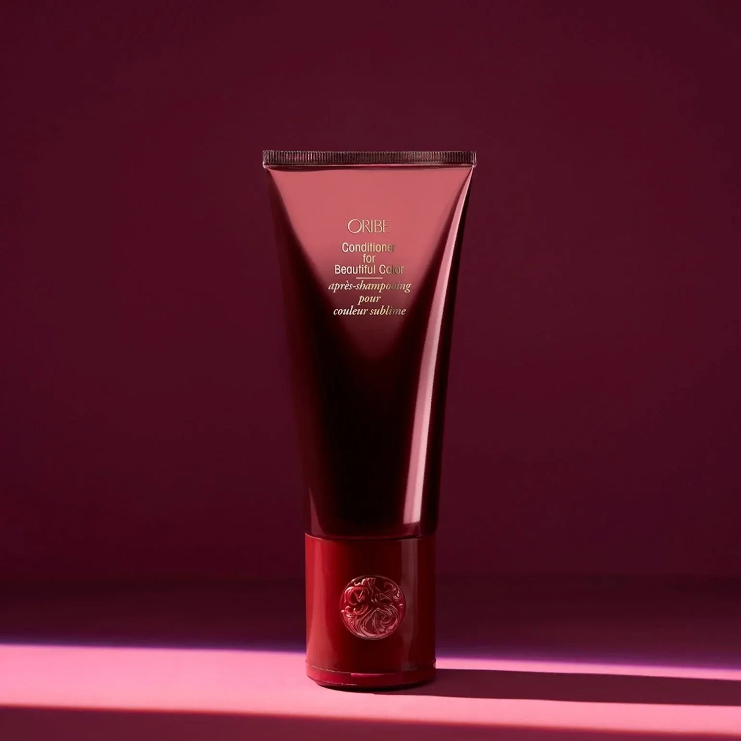 Shop Rescue Spa Oribe Conditioner for Beautiful Color in a deep red tube for color-treated hair.