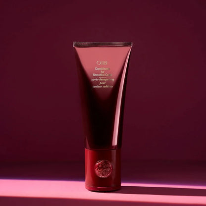Shop Rescue Spa Oribe Conditioner for Beautiful Color in a deep red tube for color-treated hair.