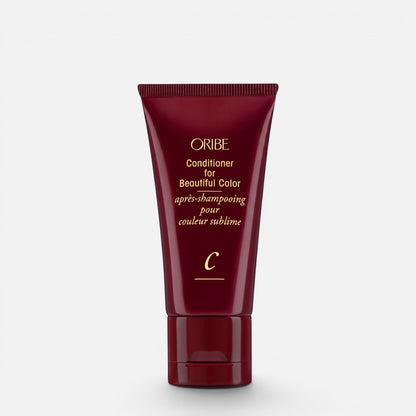 Shop Rescue Spa Oribe Conditioner for Beautiful Color in a deep red squeeze tube for color-treated hair