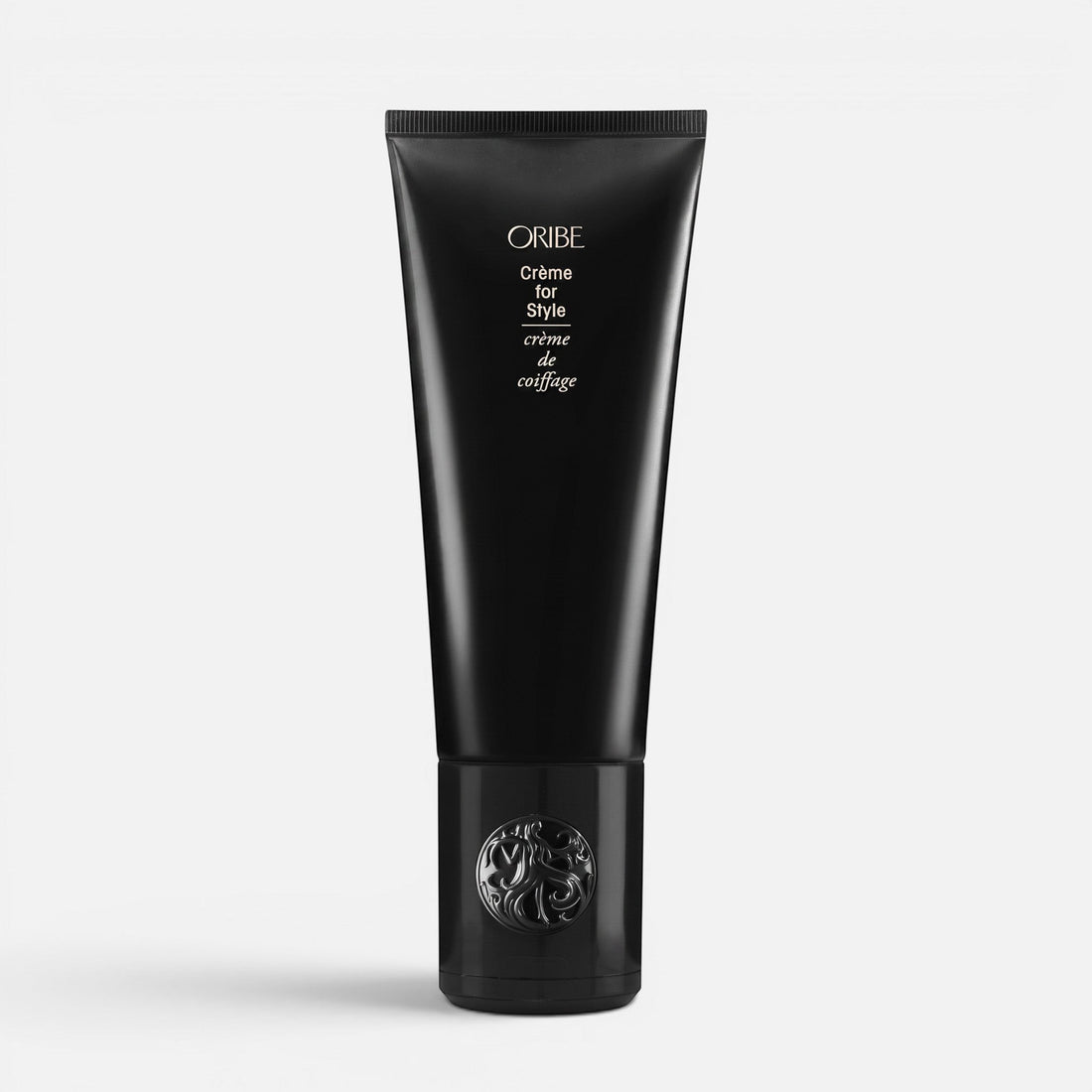 Shop Rescue Spa Oribe Creme for Style hair styling cream in a sleek black squeeze tube with decorative cap.