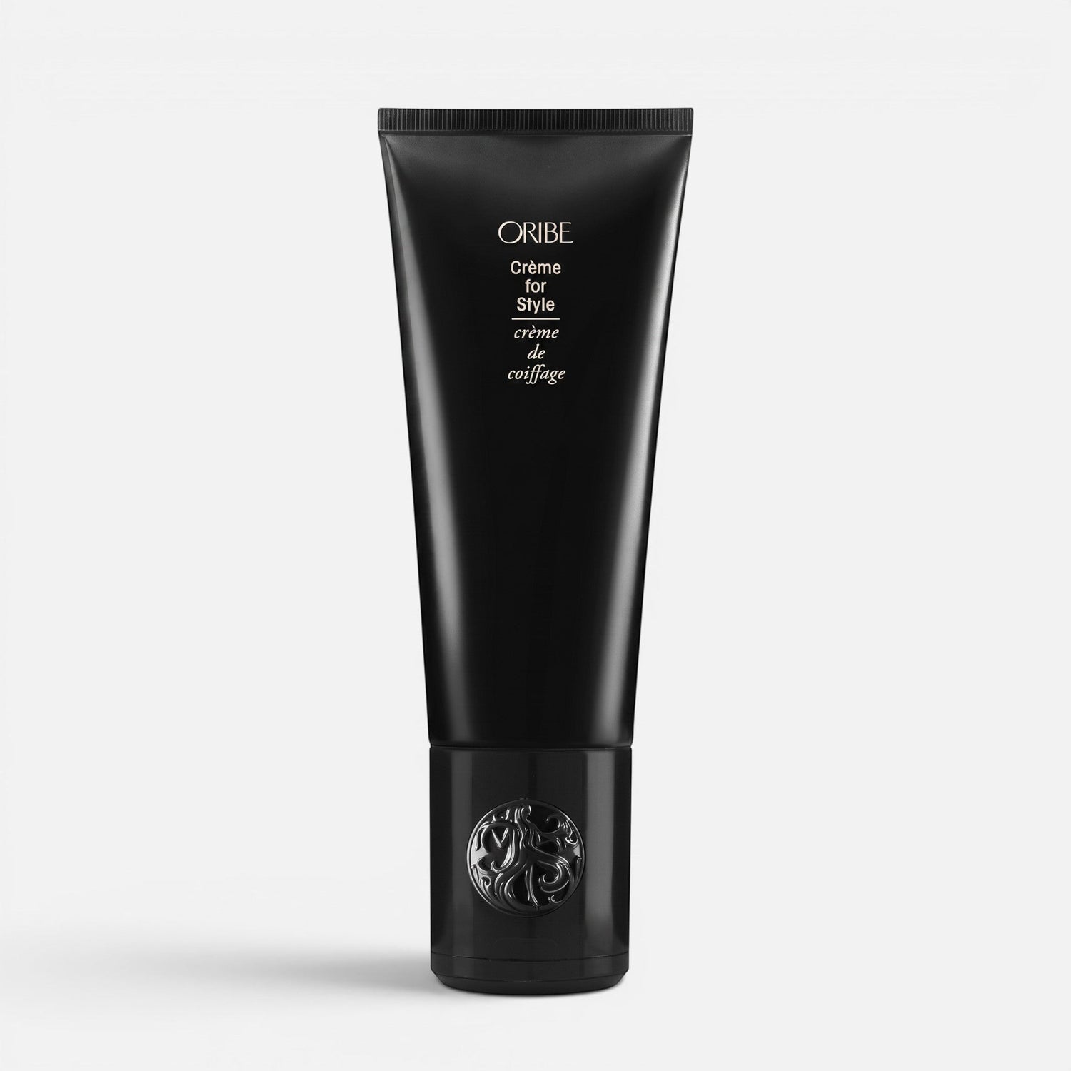 Shop Rescue Spa Oribe Creme for Style hair styling cream in a sleek black squeeze tube with decorative cap.