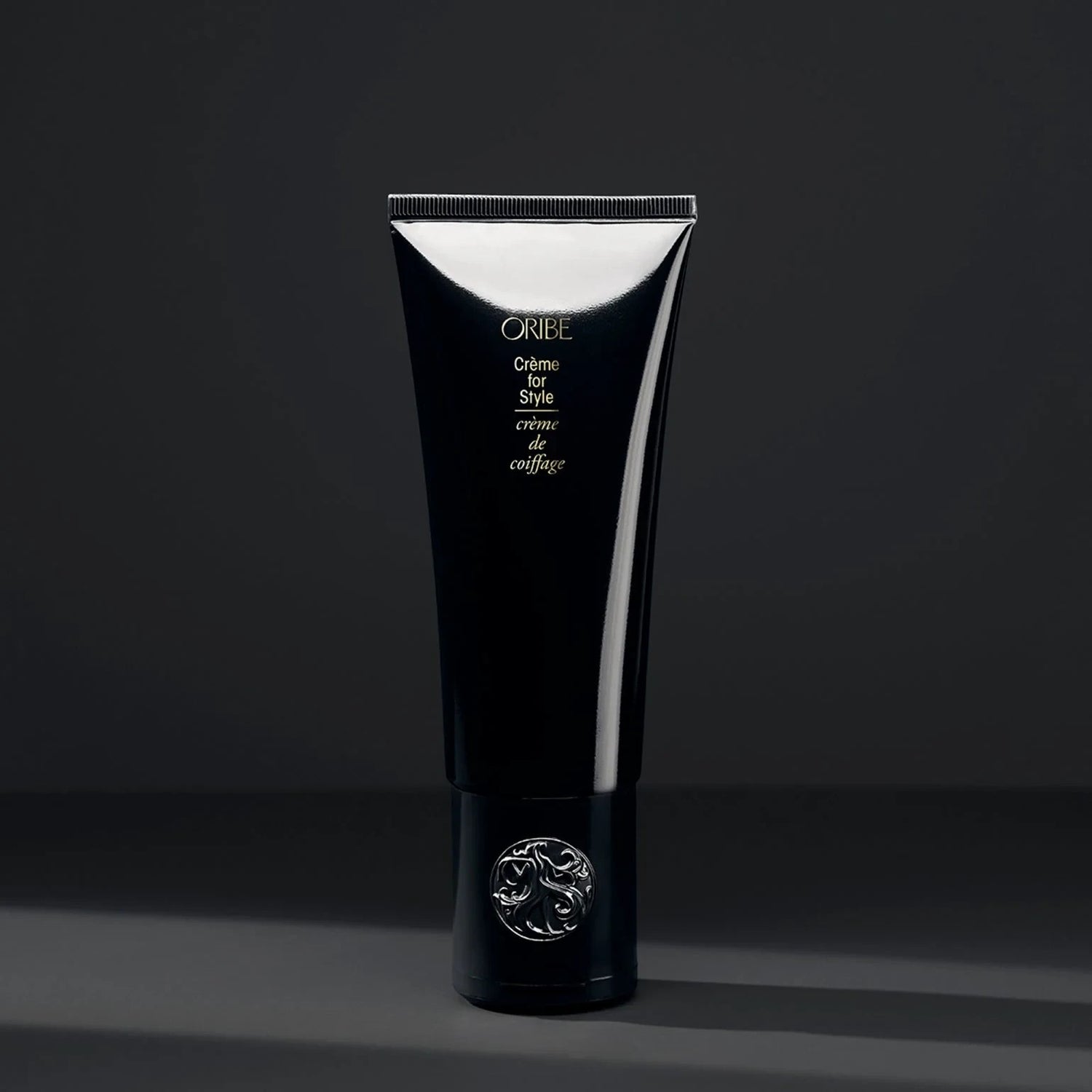 Shop Rescue Spa Oribe Creme for Style hair cream in a sleek black tube with a silver embossed cap.