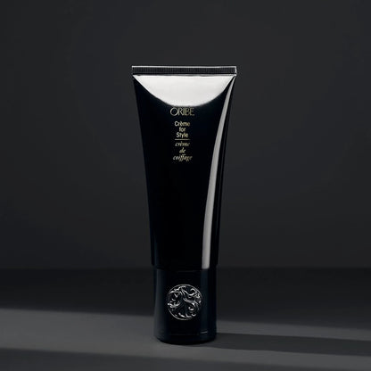 Shop Rescue Spa Oribe Creme for Style hair cream in a sleek black tube with a silver embossed cap.