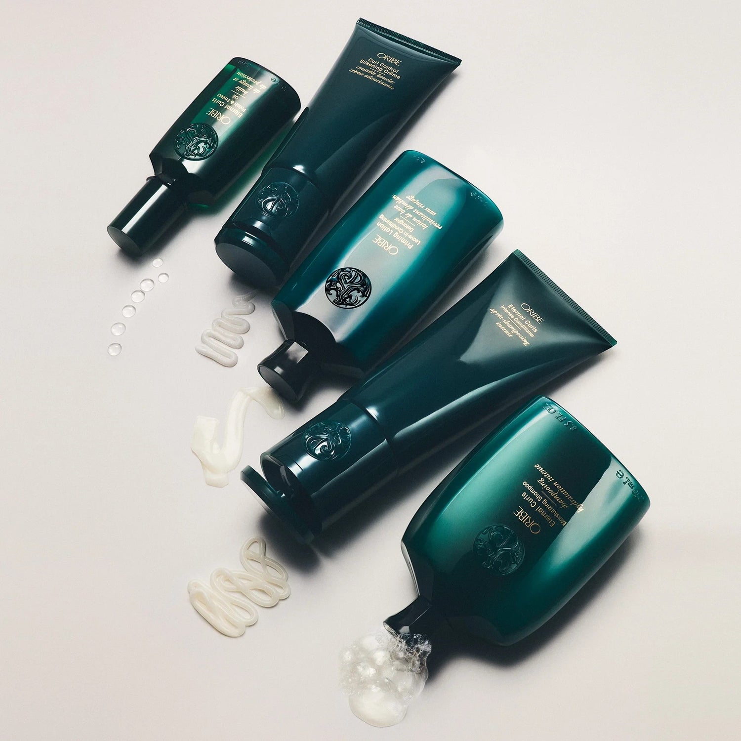 Shop Rescue Spa Oribe Curl Control Silkening Creme for defined, frizz-free curls with non-crunchy hold.