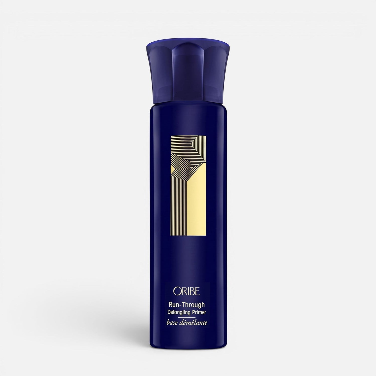 Shop Rescue Spa Oribe Run-Through Detangling Primer in a dark blue spray bottle for heat protection and detangling.