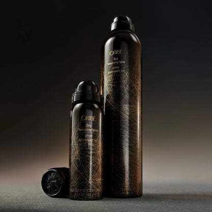 Shop Rescue Spa Oribe Dry Texturizing Spray bottles in travel and full sizes with black and gold packaging.