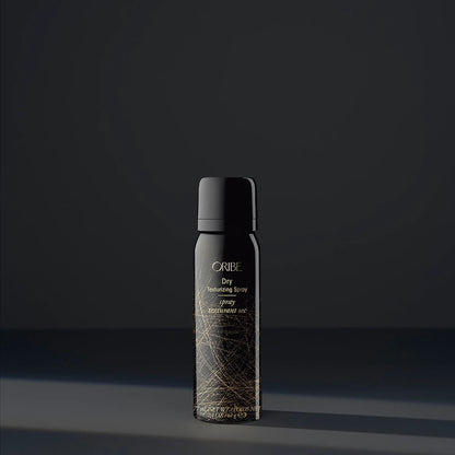 Shop Rescue Spa Oribe Dry Texturizing Spray in a black bottle with gold abstract line design for hair volume