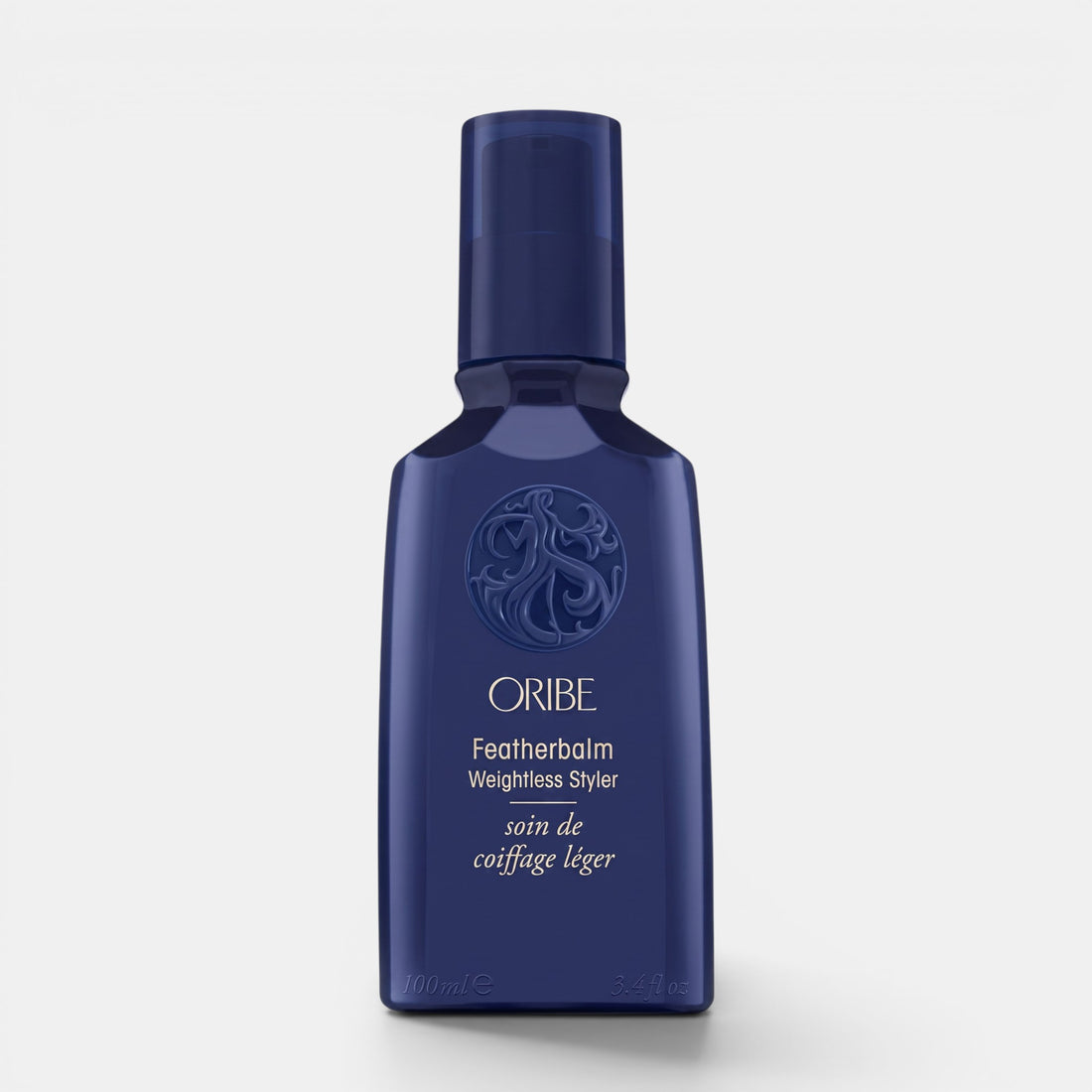 Shop Rescue Spa Oribe Featherbalm Weightless Styler in a dark blue 100ml bottle for fine to medium hair styling.