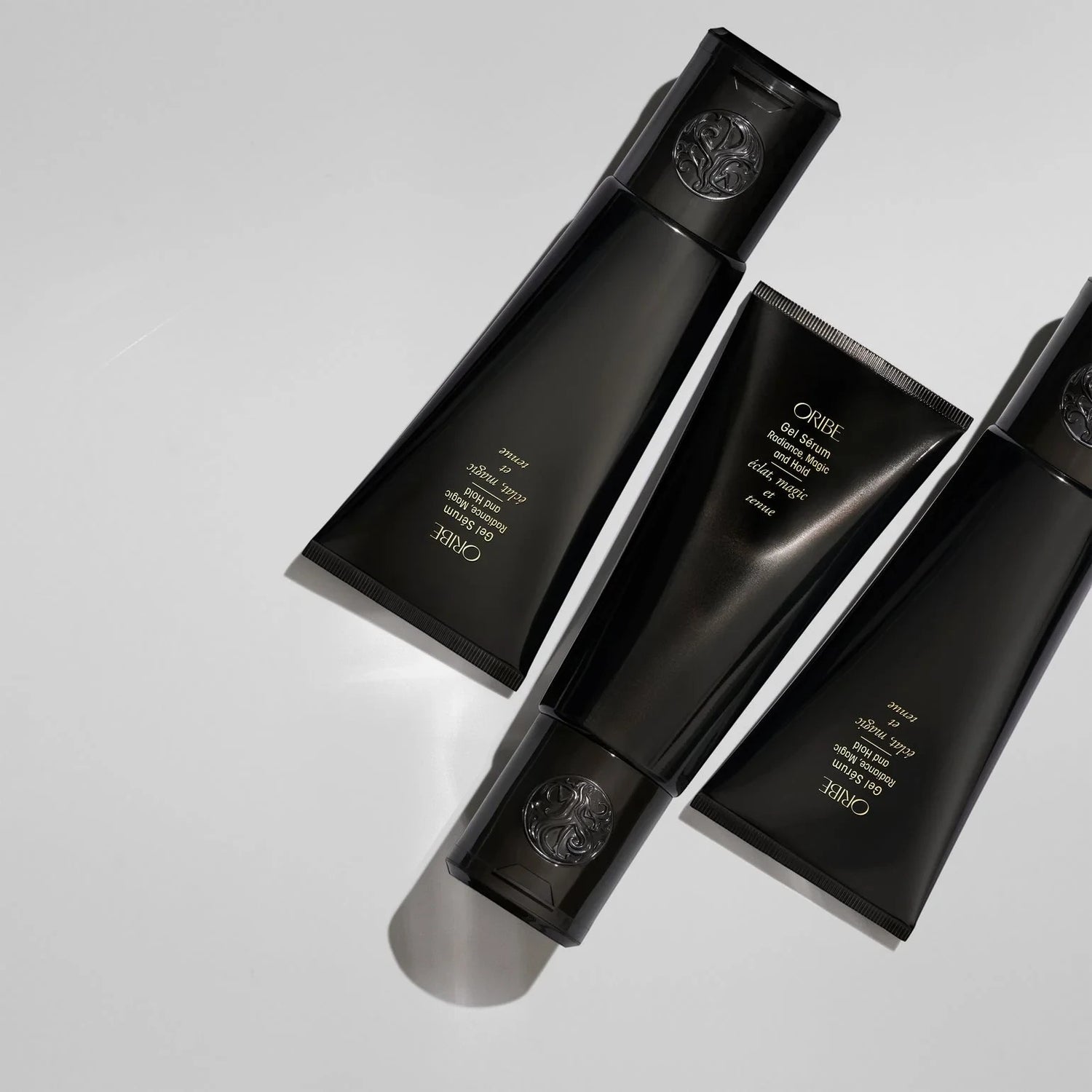Shop Rescue Spa Oribe Gel Serum with gold flecks for flexible hold and moisture. Black tubes.