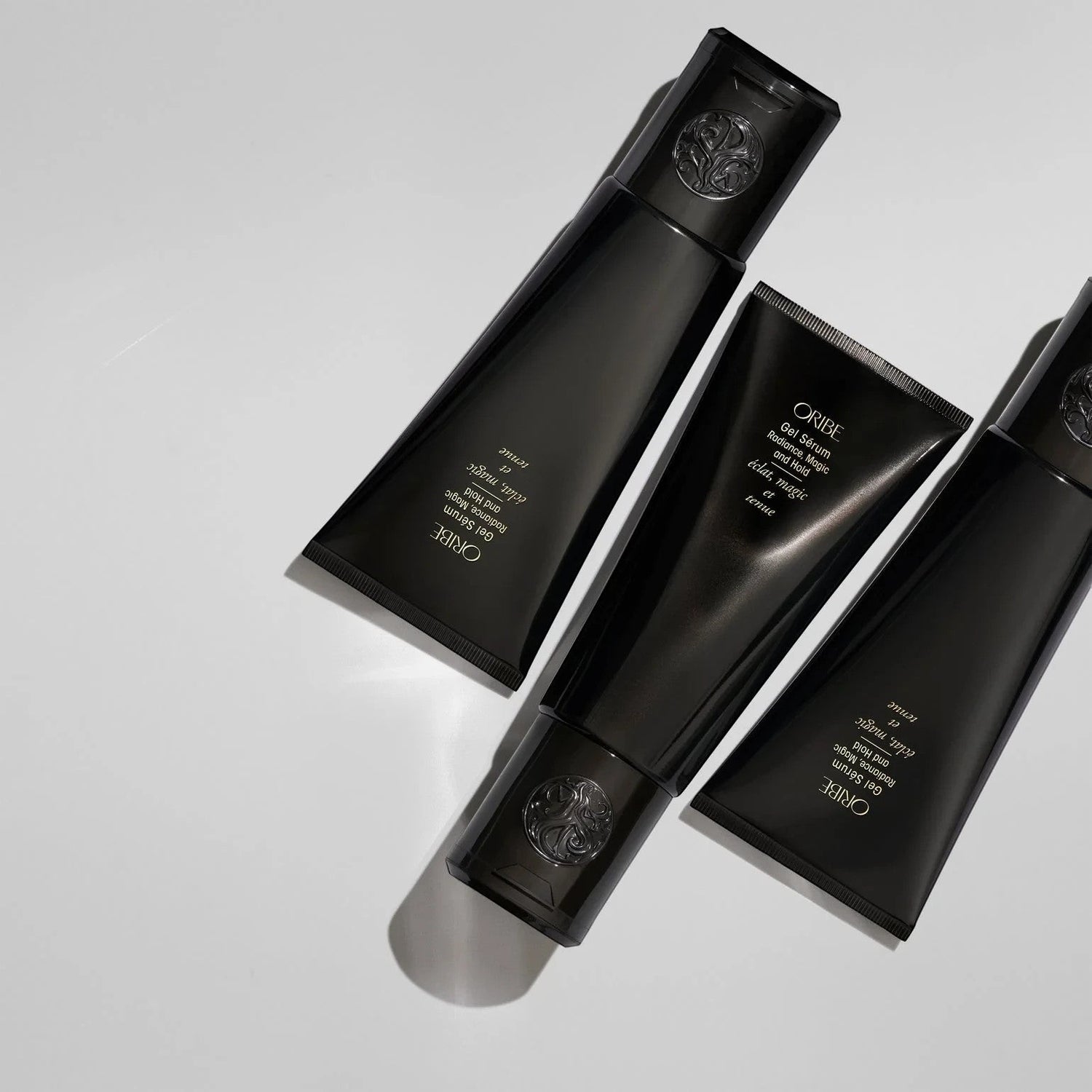 Shop Rescue Spa Oribe Gel Serum with gold flecks for flexible hold and moisture. Black tubes.