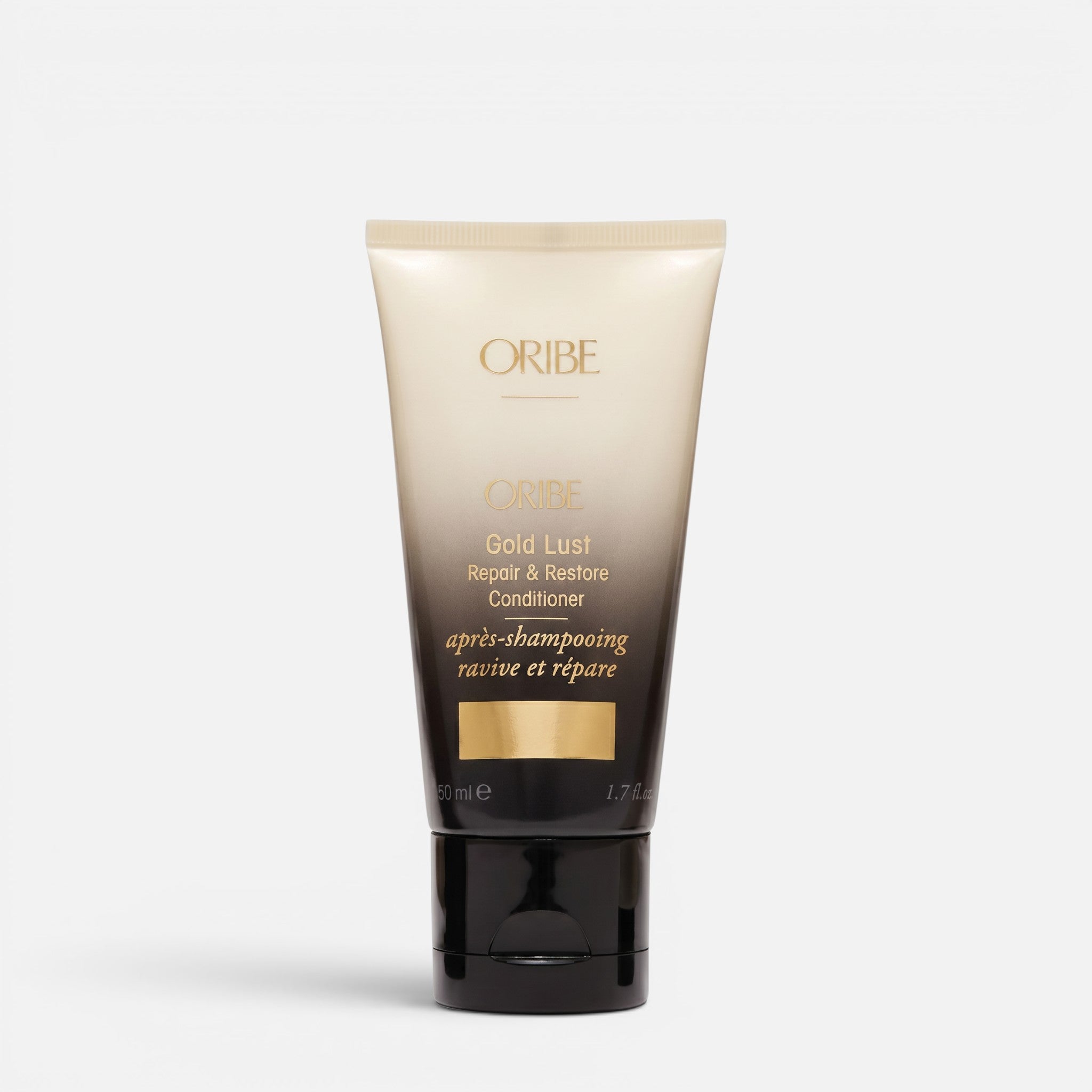 Shop Rescue Spa Oribe Gold Lust Repair and Restore Conditioner in a beige and black 50ml squeeze tube.