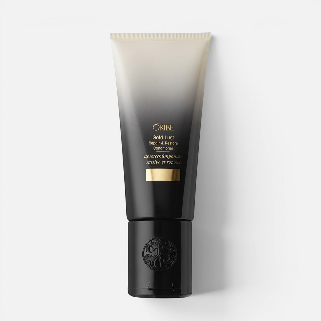 Shop Rescue Spa Oribe Gold Lust Repair and Restore Conditioner in a black and beige gradient squeeze tube.