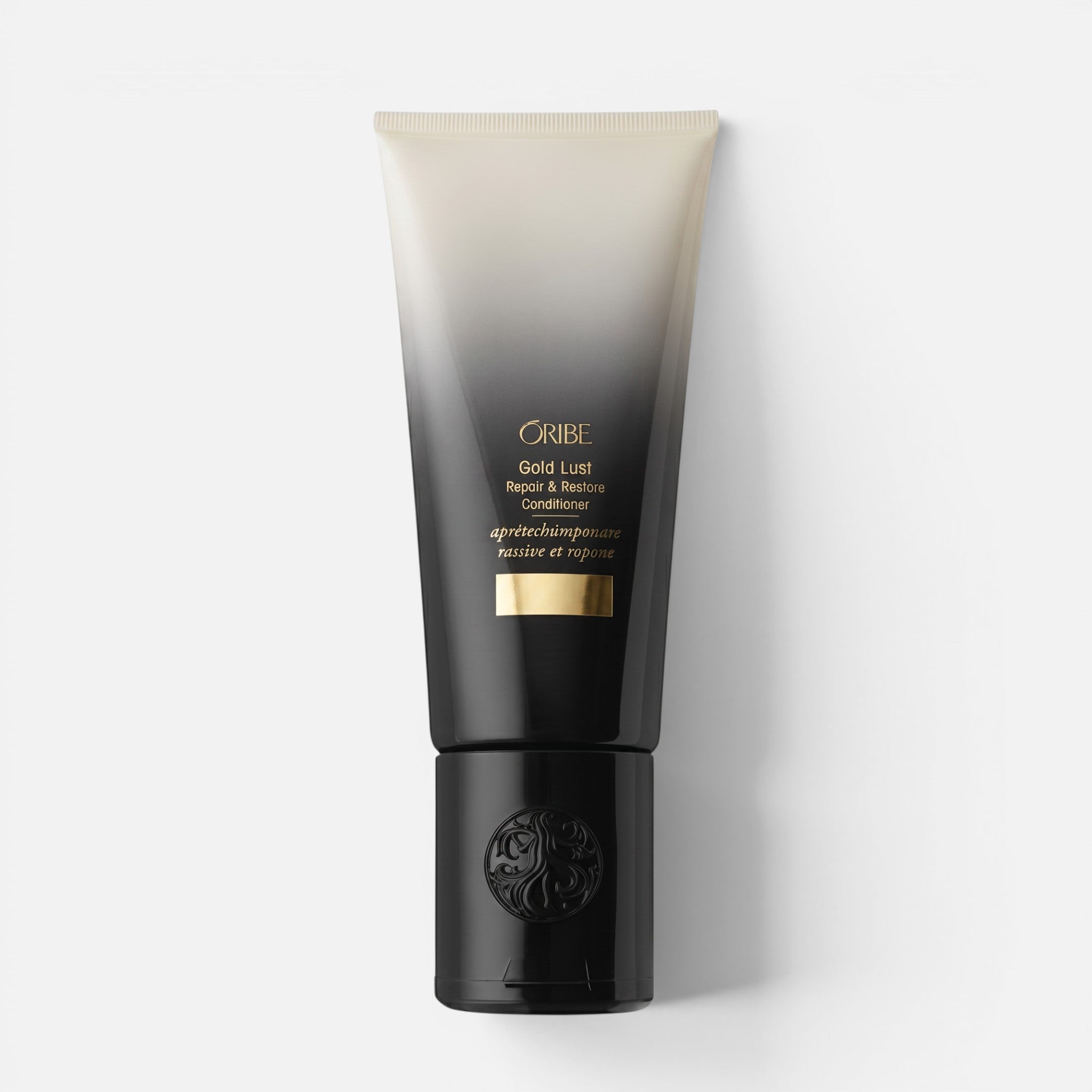 Shop Rescue Spa Oribe Gold Lust Repair and Restore Conditioner in a black and beige gradient squeeze tube.