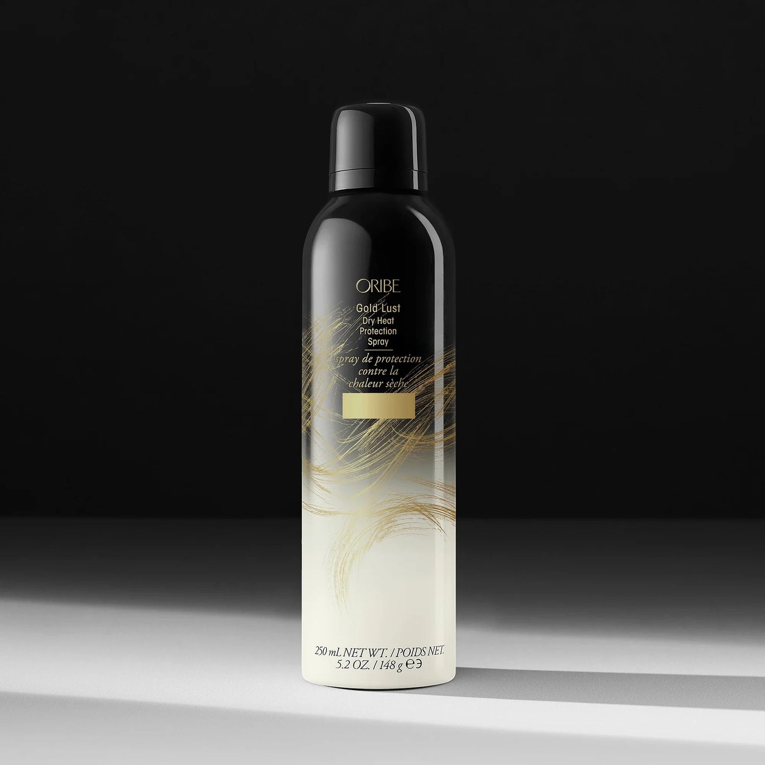 Shop Rescue Spa Oribe Gold Lust Dry Heat Protection Spray, a black aerosol can with gold accents, 250ml.