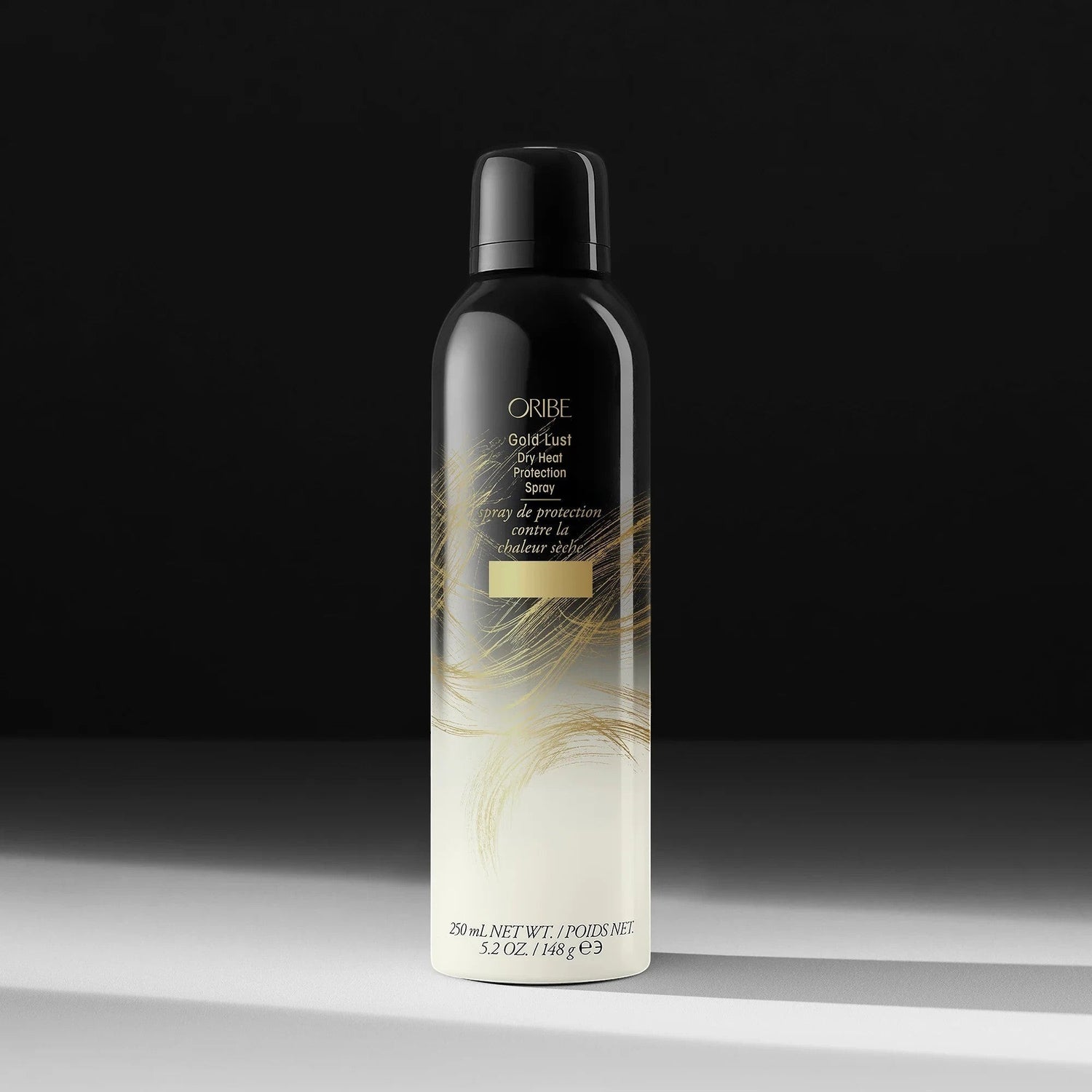 Shop Rescue Spa Oribe Gold Lust Dry Heat Protection Spray, a black aerosol can with gold accents, 250ml.