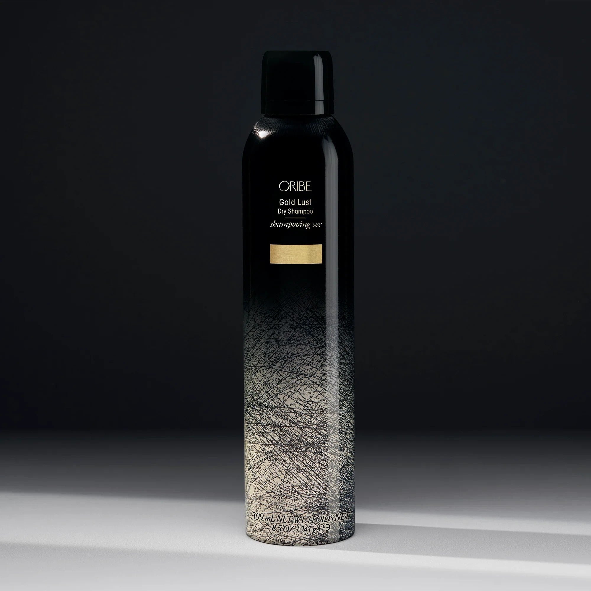 Shop Rescue Spa Oribe Gold Lust Dry Shampoo in a black and white gradient aerosol bottle with gold branding.