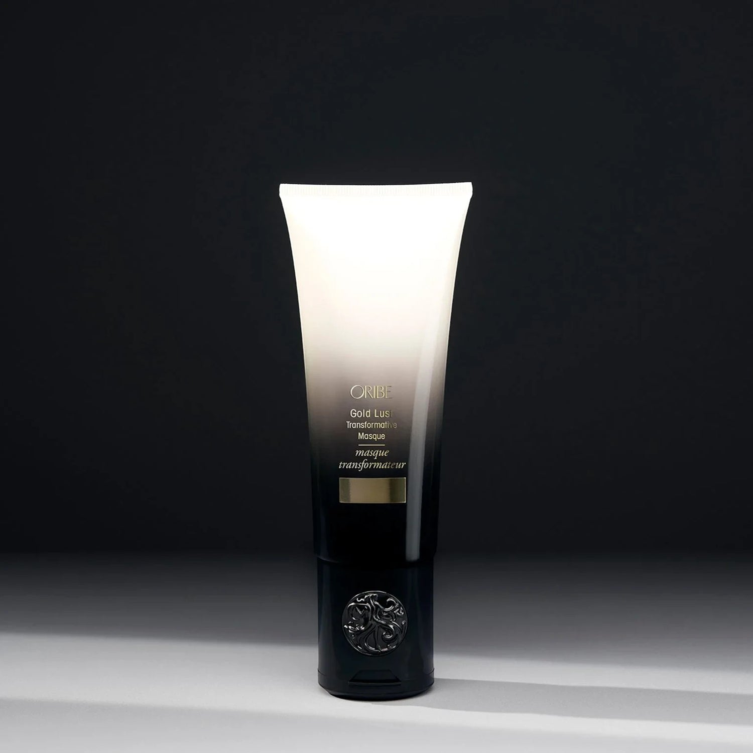 Shop Rescue Spa Oribe Gold Lust Transformative Mask in a sleek black and white gradient tube for hair repair.