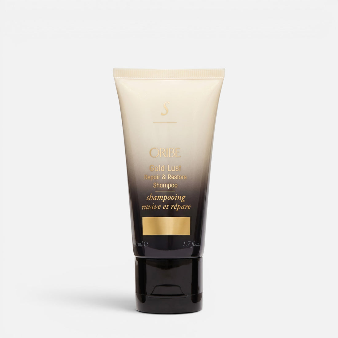 Shop Rescue Spa Oribe Gold Lust Repair &amp; Restore Shampoo in a sleek black and cream travel-sized squeeze tube.