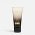 Shop Rescue Spa Oribe Gold Lust Repair & Restore Shampoo in a sleek black and cream travel-sized squeeze tube.