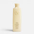 Shop Rescue Spa Oribe Hair Alchemy Fortifying Treatment Serum in a pale yellow bottle with embossed logo detail.